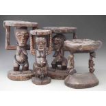 Four Songye caryatid stools carved with Nkisi power figures, the largest measures 44cm high. All