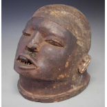 Makonde helmet mask, 24cm high All lots in this Tribal and African Art Sale are sold subject to V.