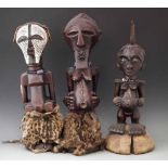 Three Songye Nkisi Power figures or Fetishes, the tallest measures 60cm overall height. All lots