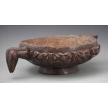 Bamileke bowl, carved with a bird head and pouring spout, 53cm wide All lots in this Tribal and