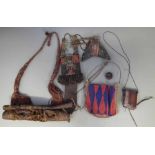 Beadwork purse, two tooled leather wallets and two hide containers, the largest hide container