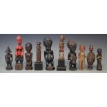 Ten small African figures, carved in various tribal styles, the tallest measures 22cm high All