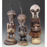 Three Songye Nkisi Power figures or Fetishes, the tallest measures 70cm overall height. All lots