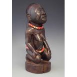 Kongo kneeling female figure, 32cm high All lots in this Tribal and African Art Sale are sold