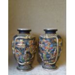 A Pair of Satsuma Bulbous Thin Necked Vases on multicoloured ground having raised figure,