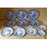 A Set of 6 Blue and White Willow Pattern Dinner Plates, 27cm diameter,