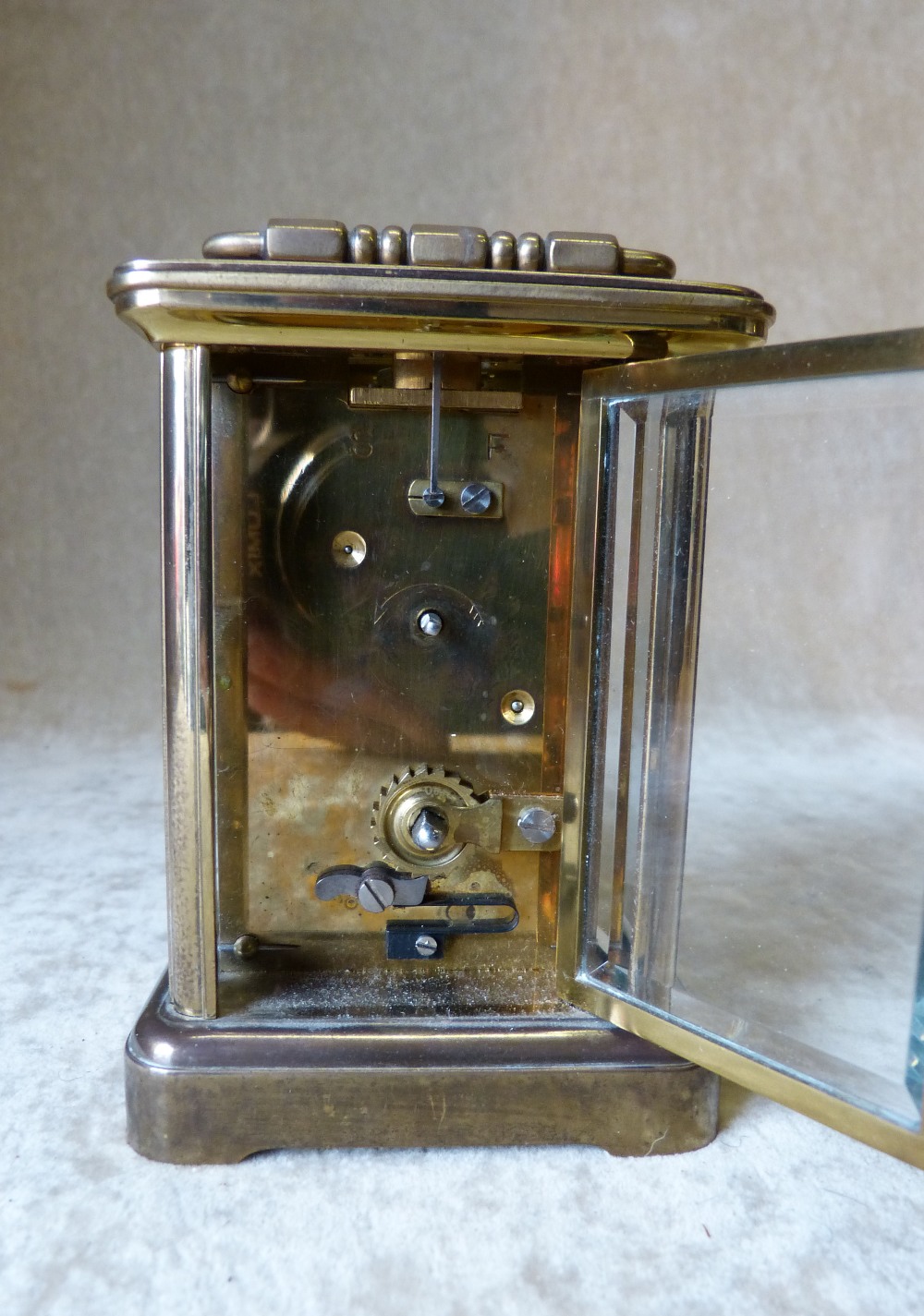 A Brass Carriage Clock having white enamel dial, Roman numerals with swing overhead handle, - Image 3 of 5