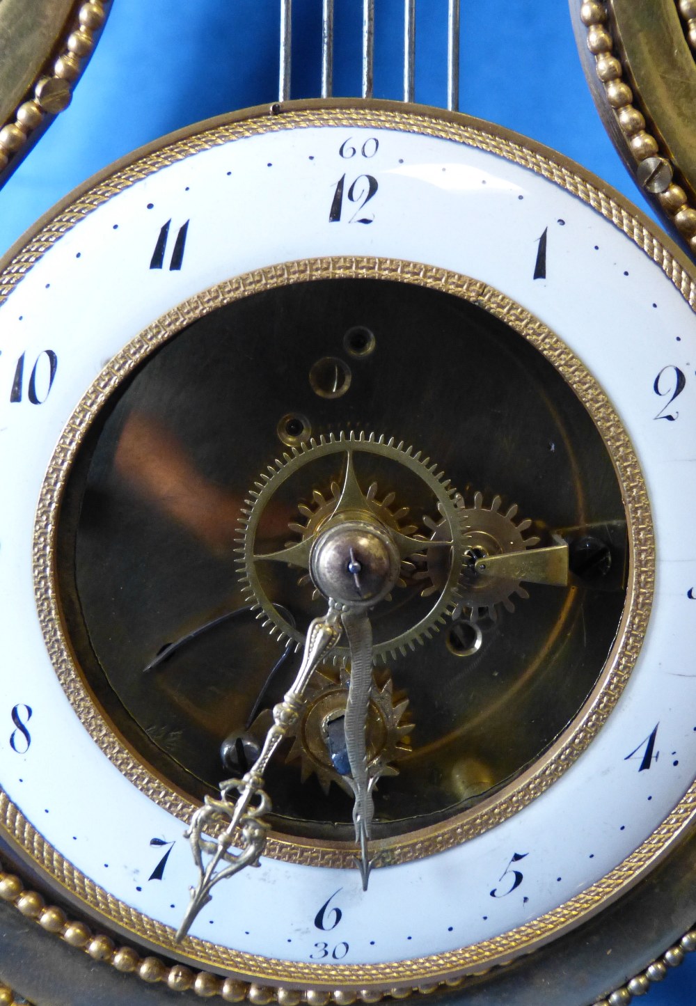 A 19th Century French Directoire Ormolu Lyer Shape Timepiece having white enamel dial, - Image 3 of 7