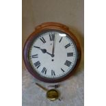 An Oak Cased Round Hanging Fuse Wall Clock having white painted dial with Roman numeral (pendulum