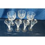 A Set of 4 Cut Glass Round Trumpet Shape Wine Glasses having thumb pattern decoration on round