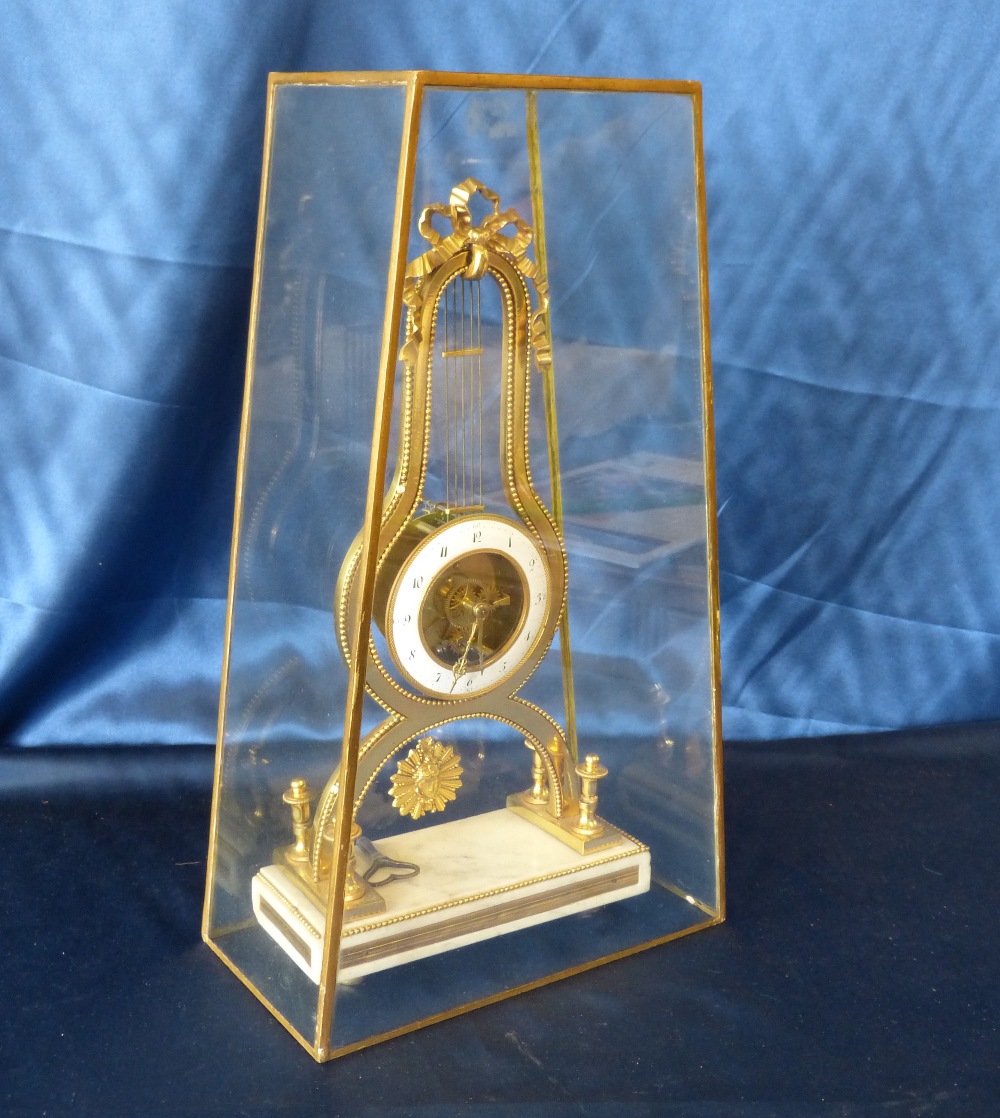 A 19th Century French Directoire Ormolu Lyer Shape Timepiece having white enamel dial, - Image 7 of 7