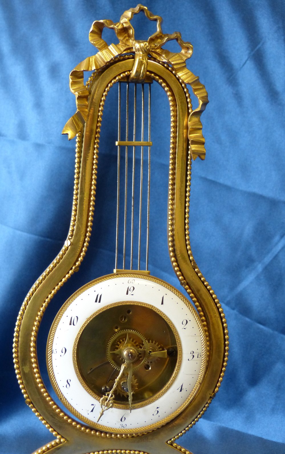 A 19th Century French Directoire Ormolu Lyer Shape Timepiece having white enamel dial, - Image 2 of 7