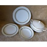 A Noritake Dinner Service on white ground having green and gilt rim comprising, oval meat plate,