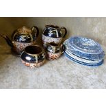 A Glazed Earthenware 4-Piece Tea Service on white and blue ground with red and gilt floral,