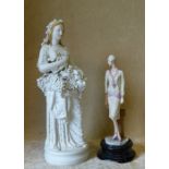 A Bisque Figure of a lady having encrusted grape and vine decoration on white ground, 33cm high,