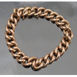 A bracelet, stamped '9c', of hollow curb links to a box clasp with safety chain,