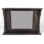 An Antique oak framed wall mirror,