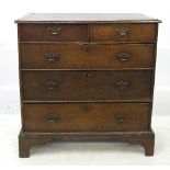 A 19th century oak chest, fitted two short drawers over three long drawers, raised on bracket feet,