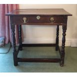 An 18th century oak side table, fitted with a frieze drawer,