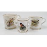 A Grainger & Co Worcester mug, decorated with a bird on a branch,