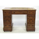 A 19th century mahogany pedestal desk, with inset leather top,