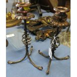 A pair of copper and wrought iron candlesticks, with twist stem and gadrooned drip tray,