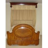 An ornate half tester bed, with canopy over,