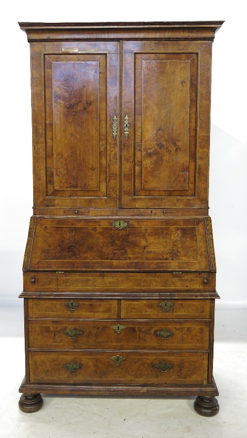 An early 18th century walnut bureau bookcase,