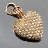 A pave pearl set heart locket, stamped '14K', monogrammed, length 2cm including bale, weight 7.