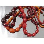 An amber coloured bead necklace, of graduated beads,