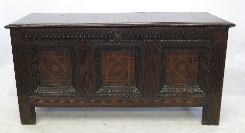 An Antique oak carved coffer,