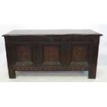 An Antique oak carved coffer,