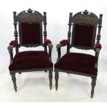 A pair of late 19th century oak hall chairs, having padded back, arms and seats,