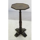 An Antique oak octagonal shaped occasional table, raised on turned column,