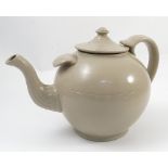 A large stoneware teapot, of bulbous form with ribbed body, height 9.