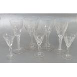 A set of six glasses, with facetted decorated and hollow stems,