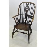 A 19th century oak and elm wheel back Windsor armchair,