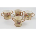 Three Royal Worcester blush ivory loving mugs, decorated with flowers,