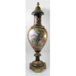 A covered Sevres vase, decorated with a blue ground reserving figures in a Classical landscape,