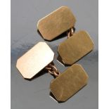 A pair of 9ct gold cufflinks, the rectangular cut corner plain panels with chain connectors,