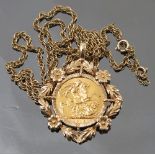 A 1915 sovereign, in a 9ct gold pendant, on a chain, weight 23.