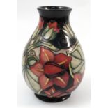 A Moorcroft Pottery baluster vase, decorated in the Palmata pattern with water lilies, height 8ins,