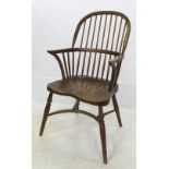 A set of four Windsor armchairs, with stick backs, raised on turned legs,