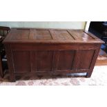 An 18th century oak coffer, with four plain panels to the rising lid,