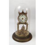 A German gilt metal anniversary clock, with white enamel dial and Roman numerals, stamped 147798,