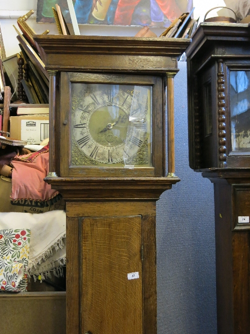 An antique oak longcase clock, the gilt dial with silvered chapter ring, engraved FRA Jones,