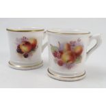 Two Royal Worcester miniature mugs, decorated with fruit to a white ground, dated 1925 and 1926,