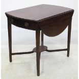 A Georgian mahogany oval Pembroke table, fitted with a frieze drawer,