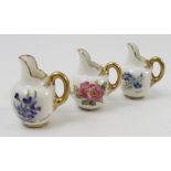 Three miniature Royal Worcester flat back jugs, hand painted with flowers, signed A Davis,