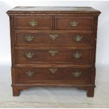 A late 18th century oak chest of drawers, with cross banded top and drawer fronts,